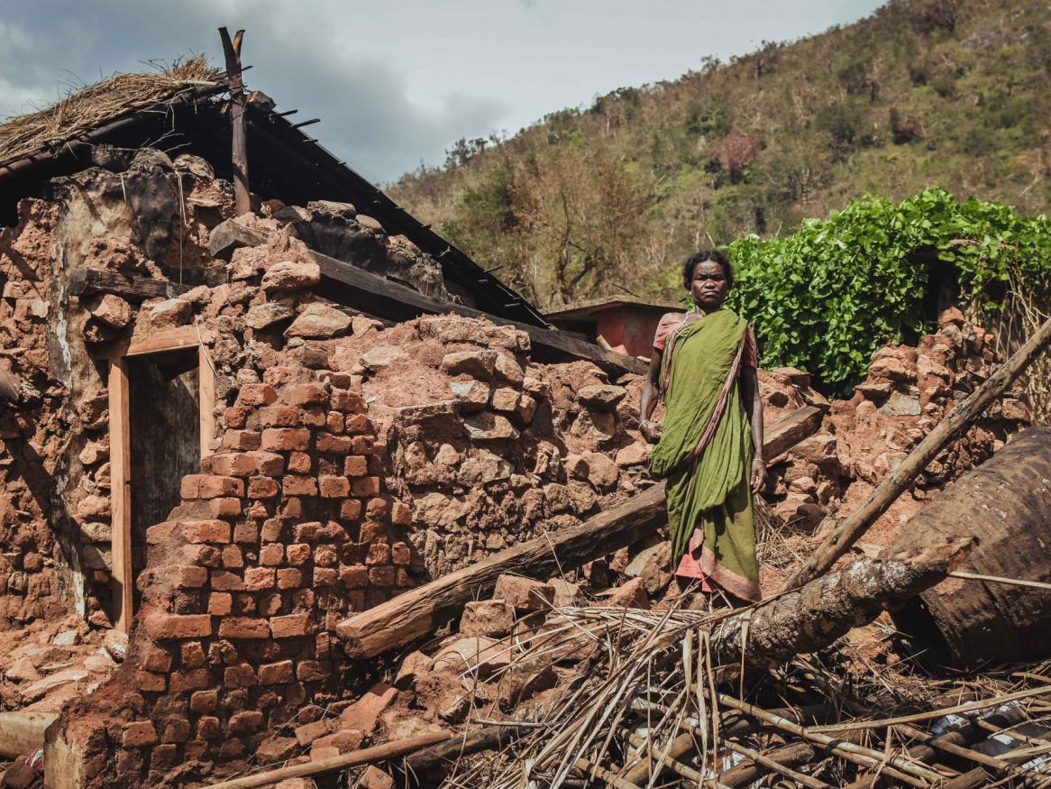 woman-standing-near-house-1667240-forweb